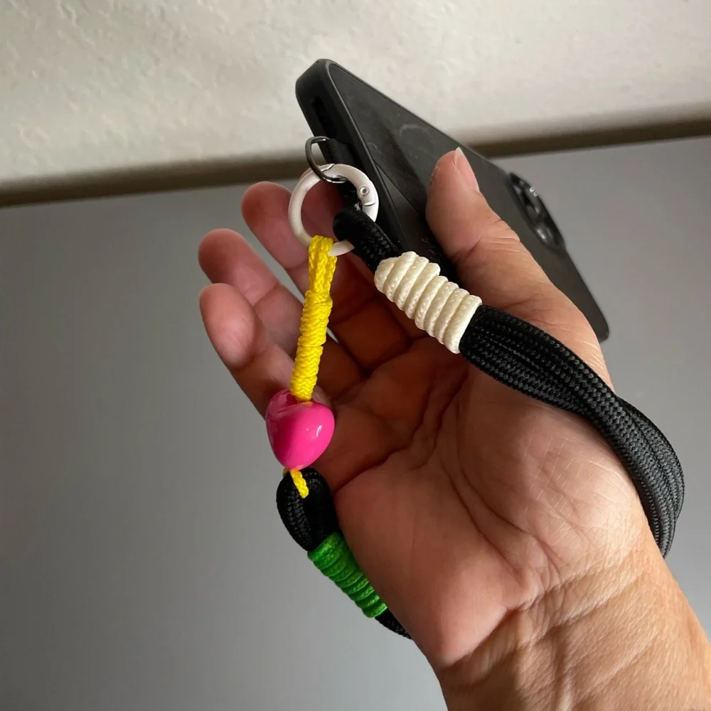 Black Phone Wrist Lanyard with Neon Accents and Pink Heart Bead